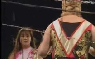 FMW – Combat Toyoda vs. Megumi Kudo (No-Rope Electrified Barbwire Deathmatch)